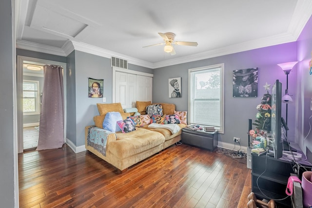 bedroom featuring multiple windows, hardwood / wood-style flooring, baseboards, a closet, and crown molding