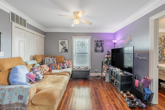 living area with wood-type flooring, a ceiling fan, and ornamental molding