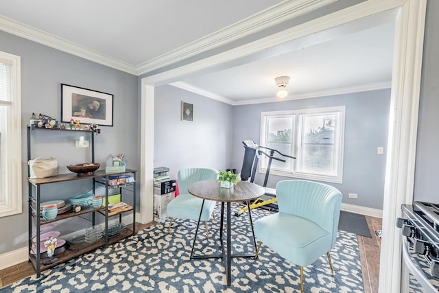 dining space featuring baseboards and crown molding