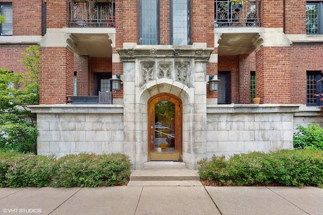 1366 E 57th St Unit 3, Chicago, IL 60637 - doorway to property featuring a balcony and brick siding