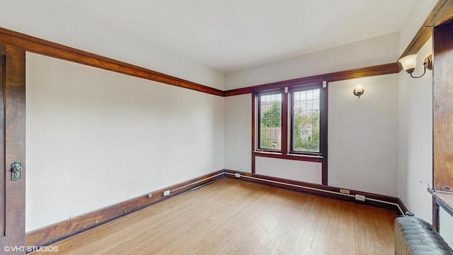 1366 E 57th St Unit 3, Chicago, IL 60637 - empty room featuring wood finished floors and baseboards