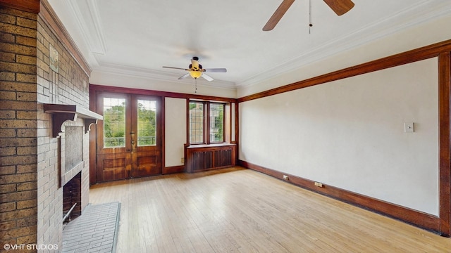 1366 E 57th St Unit 3, Chicago, IL 60637 - unfurnished living room with a ceiling fan, a fireplace, crown molding, wood-type flooring, and radiator