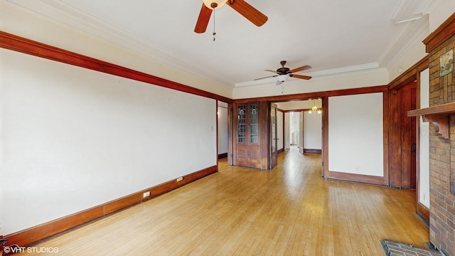 1366 E 57th St Unit 3, Chicago, IL 60637 - spare room with ceiling fan, a brick fireplace, light wood-style flooring, ornamental molding, and baseboards