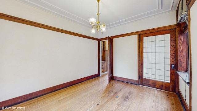 1366 E 57th St Unit 3, Chicago, IL 60637 - unfurnished room with a chandelier, crown molding, wood finished floors, and baseboards