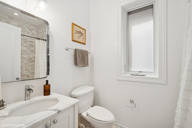 1759 W Surf St, Chicago, IL 60657 - bathroom with toilet, vanity, and curtained shower