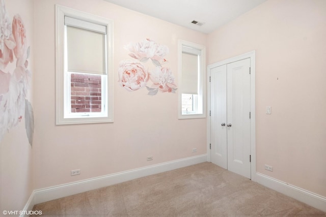 1759 W Surf St, Chicago, IL 60657 - unfurnished bedroom with carpet floors, baseboards, and a closet
