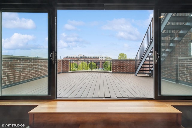 1759 W Surf St, Chicago, IL 60657 - doorway with wood finished floors and stairway