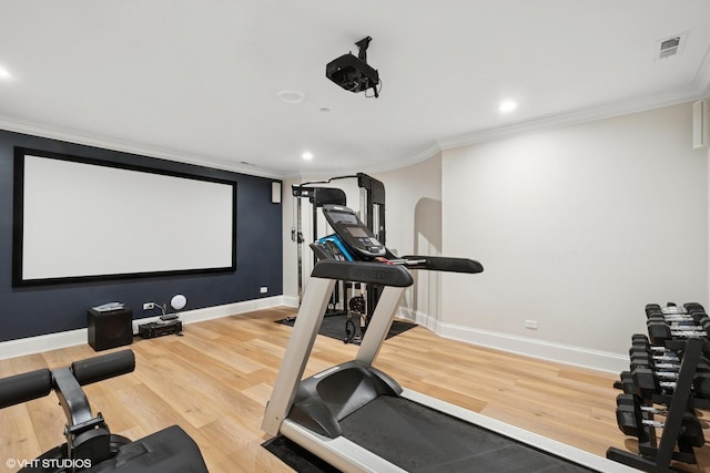 1759 W Surf St, Chicago, IL 60657 - exercise area featuring ornamental molding, wood finished floors, baseboards, and recessed lighting