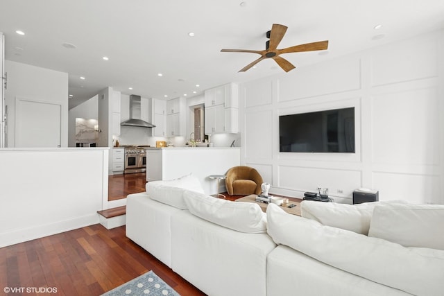 1759 W Surf St, Chicago, IL 60657 - living room featuring a decorative wall, ceiling fan, dark wood-style floors, and recessed lighting