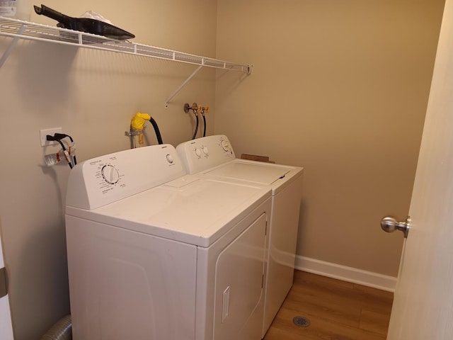 7537 175th St Unit 514, Tinley Park, IL 60477 - laundry room featuring separate washer and dryer, light wood-style floors, and baseboards