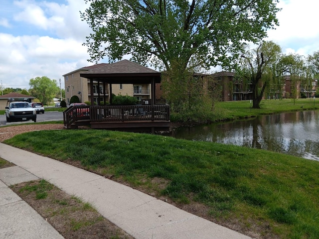 7537 175th St Unit 514, Tinley Park, IL 60477 - view of front of house with a deck with water view and a front yard