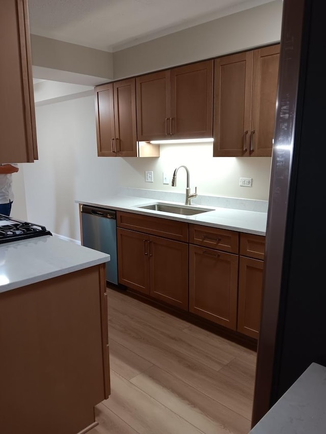 7537 175th St Unit 514, Tinley Park, IL 60477 - kitchen with a sink, stainless steel dishwasher, light wood-type flooring, light countertops, and brown cabinets