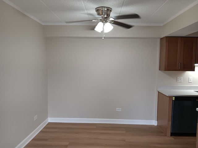 7537 175th St Unit 514, Tinley Park, IL 60477 - unfurnished dining area featuring ceiling fan, light wood-style floors, baseboards, and crown molding