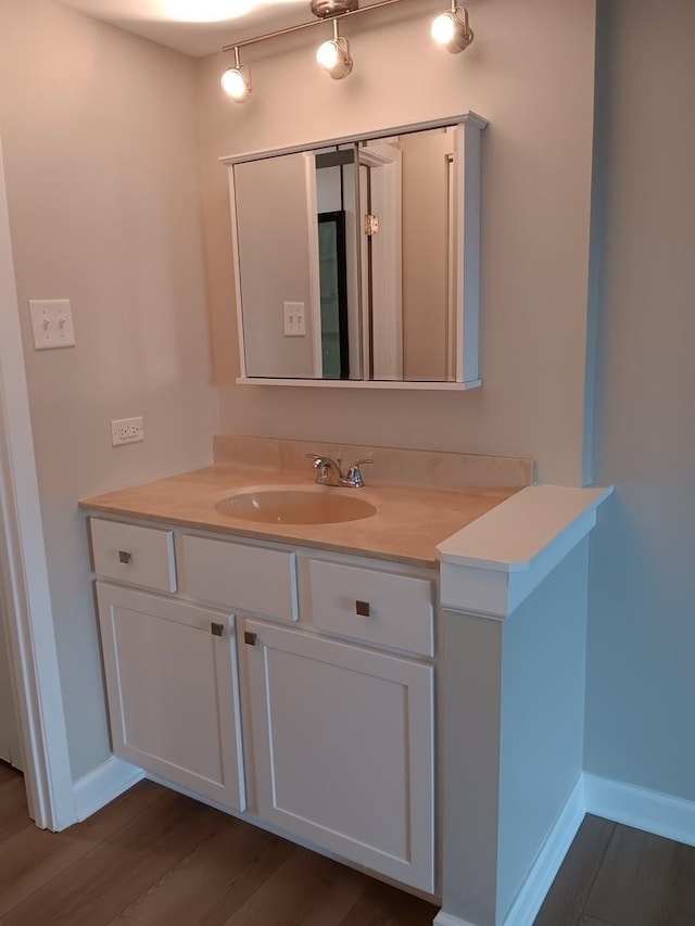 7537 175th St Unit 514, Tinley Park, IL 60477 - bathroom with wood finished floors, baseboards, and vanity
