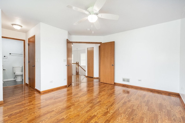 1376 Dahlgren Ln, Minooka, IL 60447 - spare room featuring light wood-style floors, baseboards, and ceiling fan