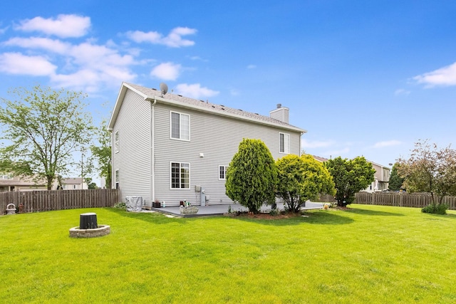1376 Dahlgren Ln, Minooka, IL 60447 - rear view of property featuring a chimney, a patio, and a fire pit