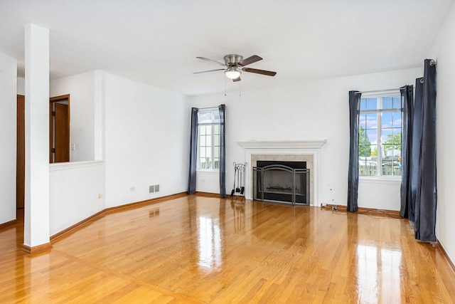 1376 Dahlgren Ln, Minooka, IL 60447 - unfurnished living room featuring light wood-type flooring, healthy amount of natural light, and ceiling fan