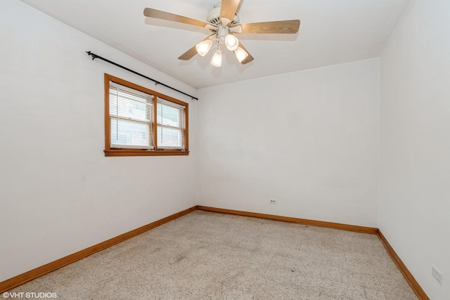 7745 S Kilpatrick Ave, Chicago, IL 60652 - spare room featuring baseboards and a ceiling fan