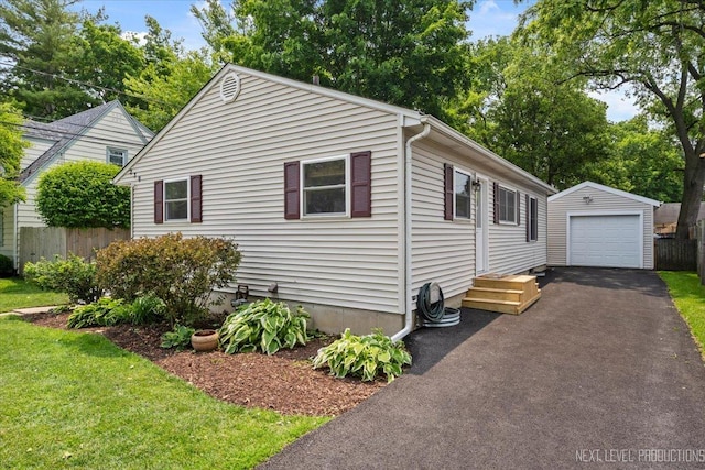 230 Union Ave, Batavia, IL 60510 - view of front of property with a garage, an outbuilding, and asphalt driveway