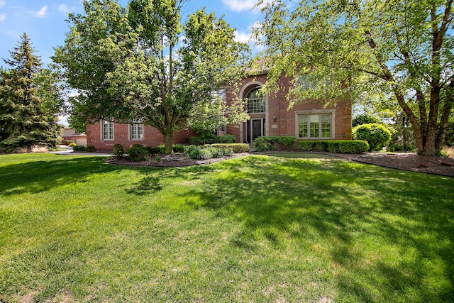 22388 Crimson Ln, Frankfort, IL 60423 - obstructed view of property featuring brick siding and a front yard