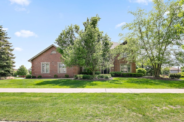 22388 Crimson Ln, Frankfort, IL 60423 - view of front facade featuring brick siding and a front yard
