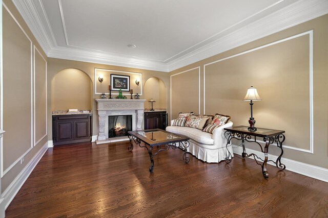 22388 Crimson Ln, Frankfort, IL 60423 - living room with arched walkways, a lit fireplace, wood finished floors, a decorative wall, and ornamental molding
