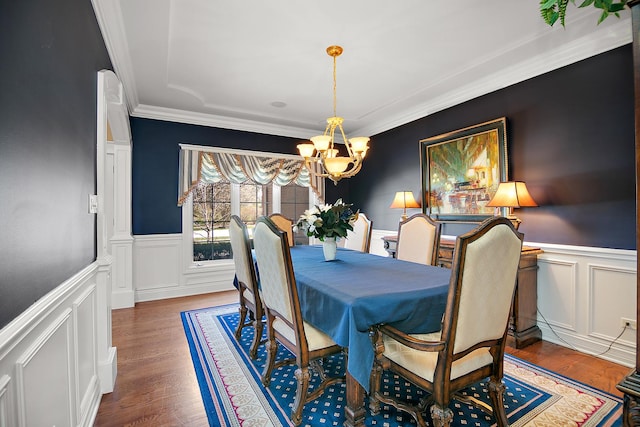 22388 Crimson Ln, Frankfort, IL 60423 - dining space featuring a chandelier, a decorative wall, ornamental molding, wood finished floors, and a wainscoted wall