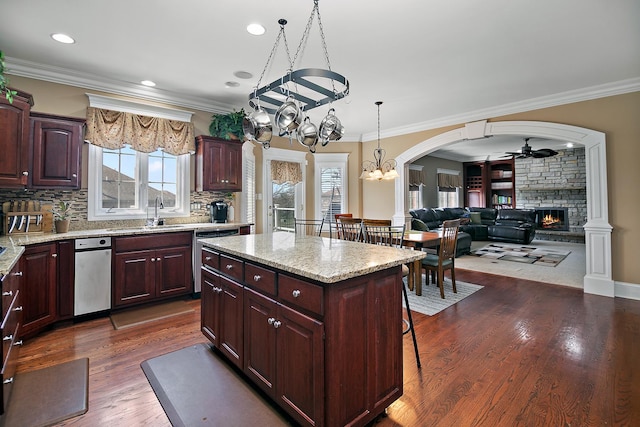 22388 Crimson Ln, Frankfort, IL 60423 - kitchen featuring stainless steel dishwasher, a chandelier, a sink, a fireplace, and ceiling fan