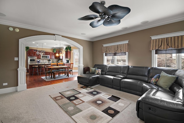 22388 Crimson Ln, Frankfort, IL 60423 - living area with arched walkways, ornamental molding, plenty of natural light, carpet, and ceiling fan