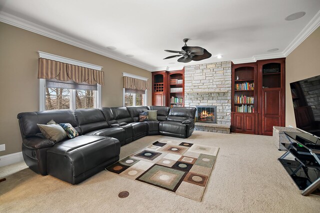 22388 Crimson Ln, Frankfort, IL 60423 - carpeted living room with a stone fireplace, crown molding, a ceiling fan, and built in shelves