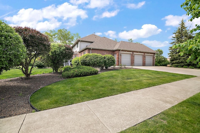 22388 Crimson Ln, Frankfort, IL 60423 - view of front of home with brick siding, a garage, concrete driveway, and a front yard