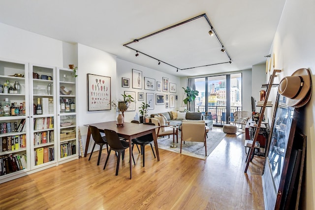 330 N Jefferson St Unit 903, Chicago, IL 60661 - dining area with rail lighting and light wood-style floors
