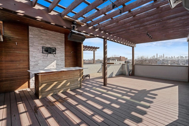 513 N Claremont Ave Unit 3S, Chicago, IL 60612 - wooden terrace featuring a pergola and a skyline view