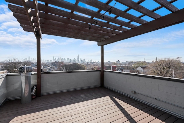 513 N Claremont Ave Unit 3S, Chicago, IL 60612 - wooden terrace with a view of skyline and a pergola