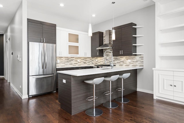 513 N Claremont Ave Unit 3S, Chicago, IL 60612 - kitchen featuring freestanding refrigerator, light countertops, a breakfast bar area, open shelves, and modern cabinets
