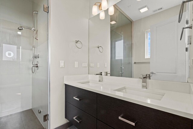 513 N Claremont Ave Unit 3S, Chicago, IL 60612 - full bath featuring a stall shower, double vanity, and tile patterned flooring