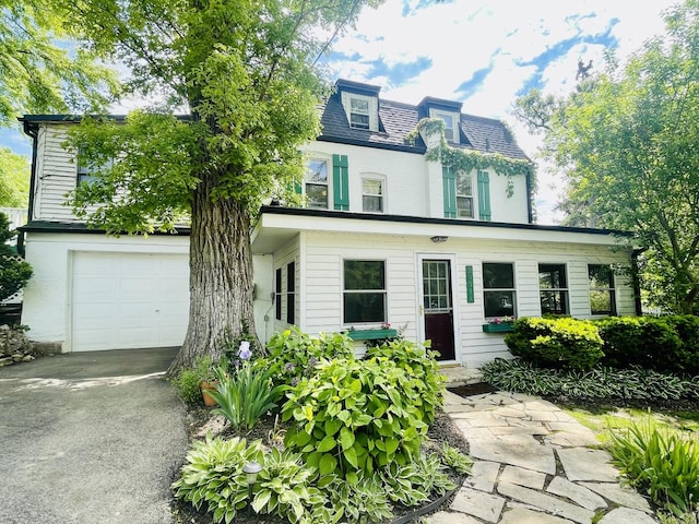 24311 N Bonnie Ln, Lake Zurich, IL 60047 - view of front of home featuring an attached garage, driveway, and mansard roof