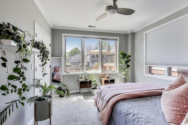 2700 N Halsted St Unit 211, Chicago, IL 60614 - bedroom with carpet, multiple windows, ornamental molding, baseboards, and a ceiling fan