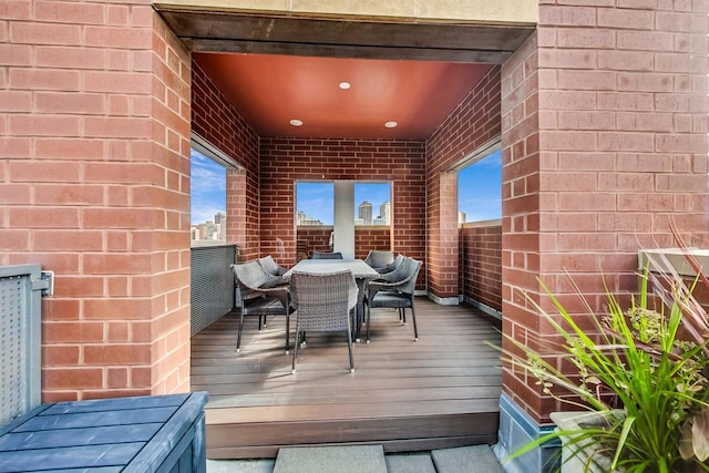 wooden deck featuring outdoor dining space