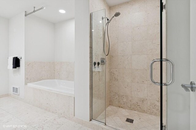 60 E Monroe St Unit 2607, Chicago, IL 60603 - full bathroom featuring a stall shower, a bath, and tile patterned flooring