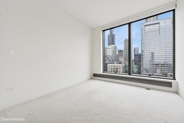 60 E Monroe St Unit 2607, Chicago, IL 60603 - empty room featuring carpet, a view of skyline, and baseboards
