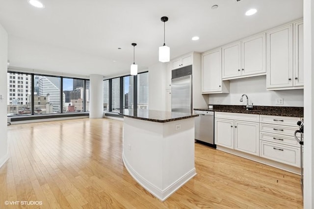 60 E Monroe St Unit 2607, Chicago, IL 60603 - kitchen featuring stainless steel appliances, light wood finished floors, a sink, white cabinetry, and recessed lighting
