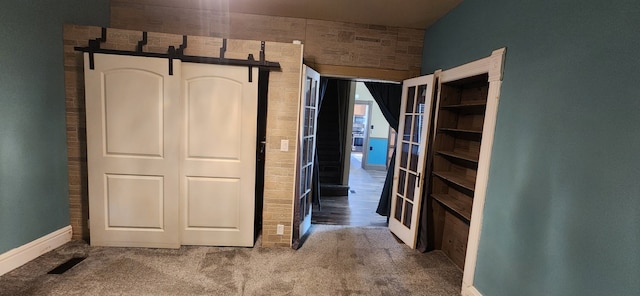 unfurnished bedroom with carpet and baseboards