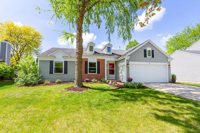 31 Jefferson Ln, Streamwood, IL 60107 - view of front of home with an attached garage, concrete driveway, a front lawn, brick siding, and roof with shingles