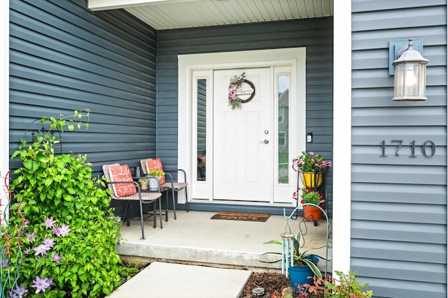 doorway to property with covered porch