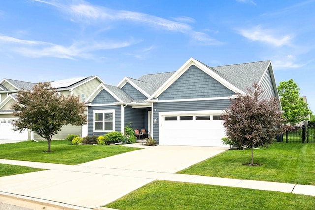 craftsman-style home with an attached garage and concrete driveway