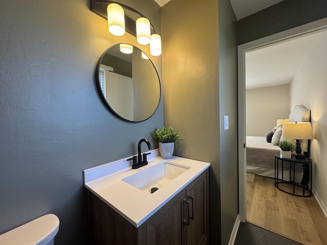 5024 W 122nd St Unit 2B, Alsip, IL 60803 - ensuite bathroom featuring vanity and wood finished floors