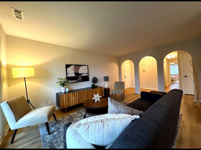 5024 W 122nd St Unit 2B, Alsip, IL 60803 - living room featuring arched walkways and wood finished floors