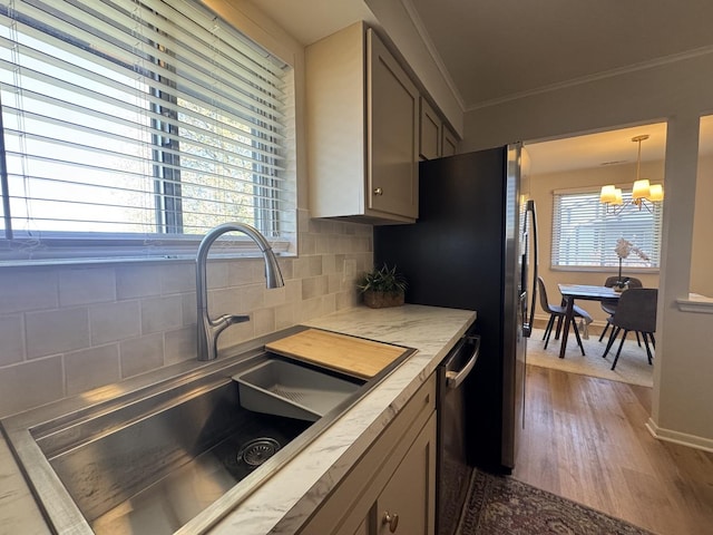 5024 W 122nd St Unit 2B, Alsip, IL 60803 - kitchen featuring a chandelier, dark wood-type flooring, decorative backsplash, crown molding, and light countertops