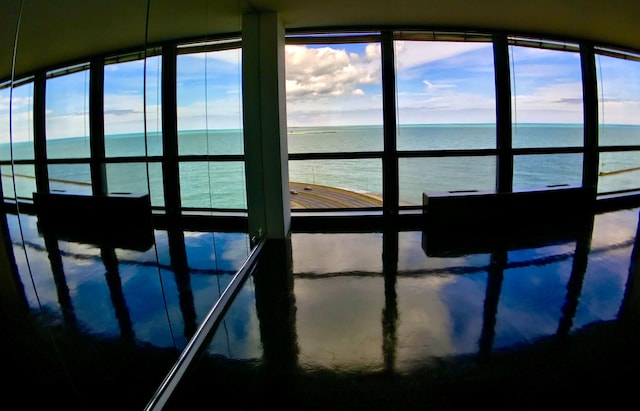 view of pool with a water view